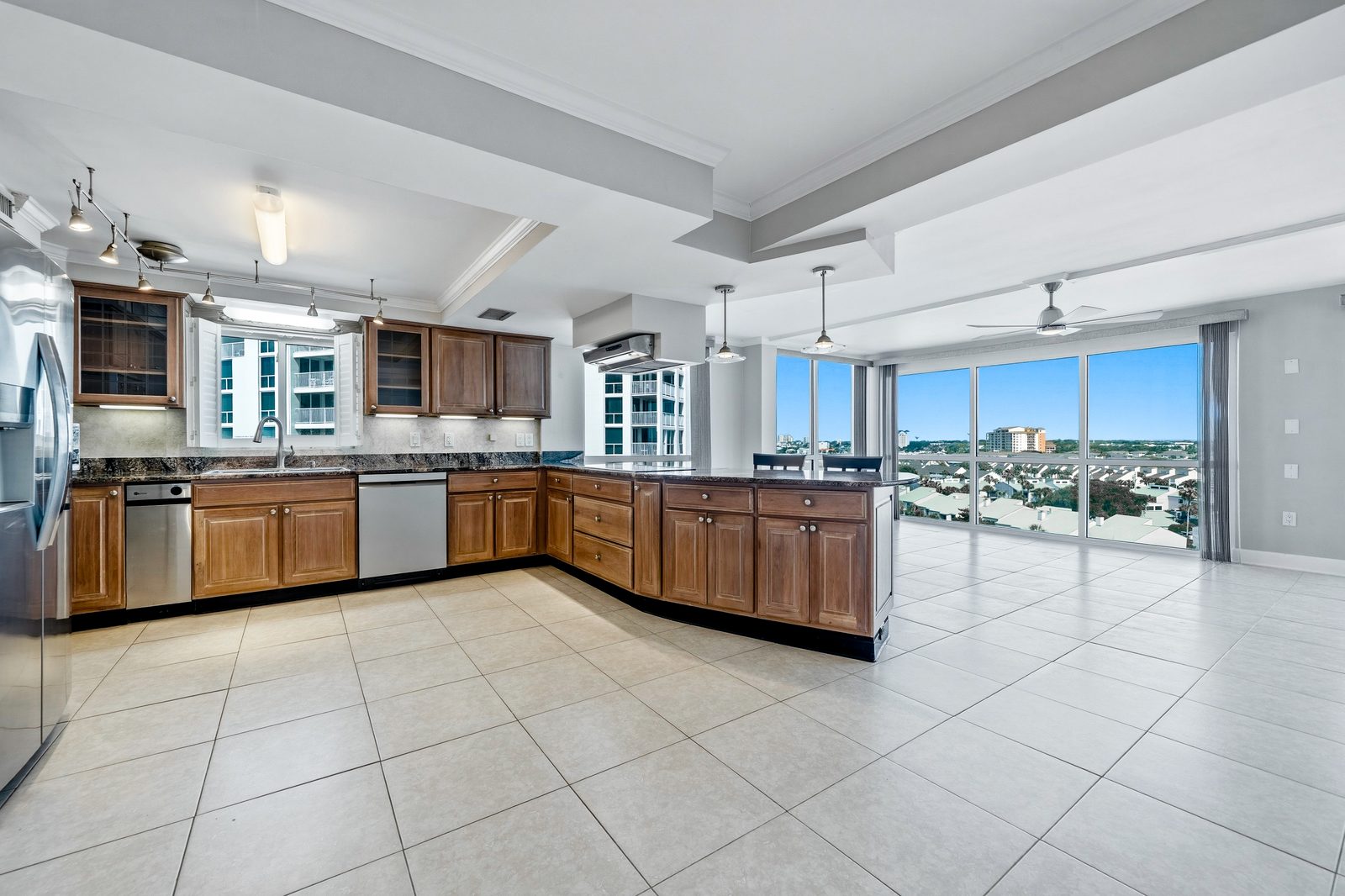 Open kitchen and living area in a coastal high-rise condo