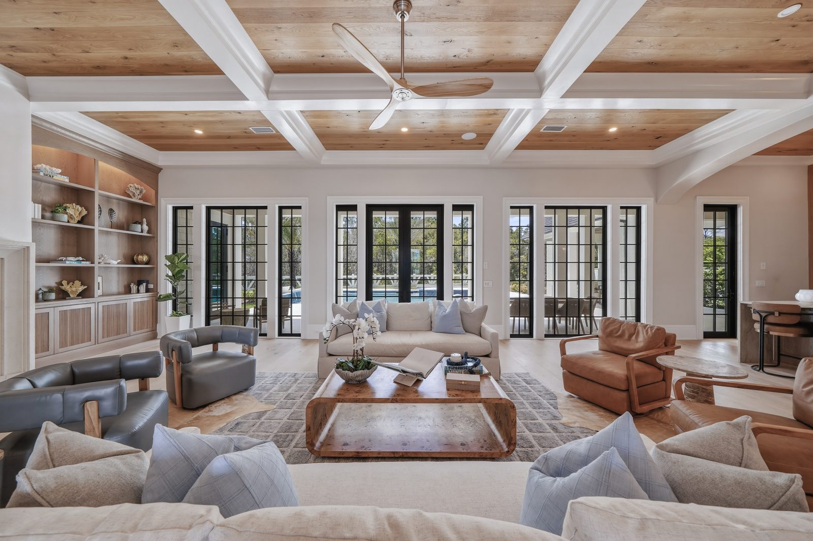 Living room with French doors opening to the pool