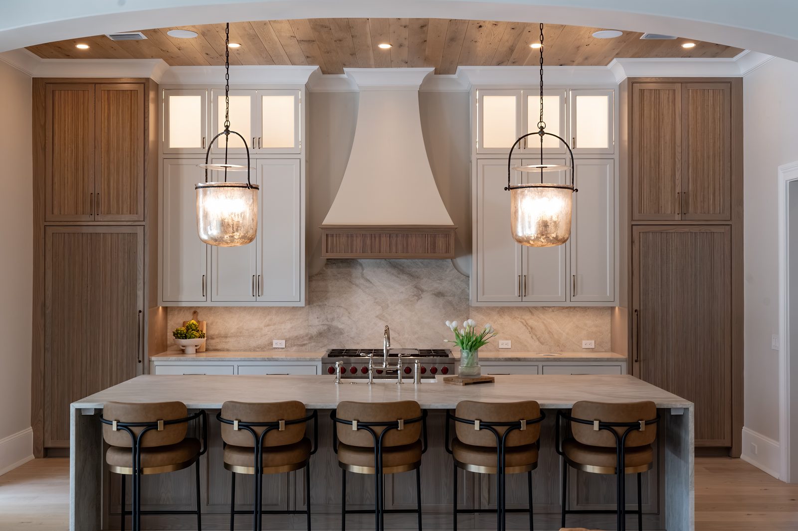 Kitchen island with pendant lighting and bar seating