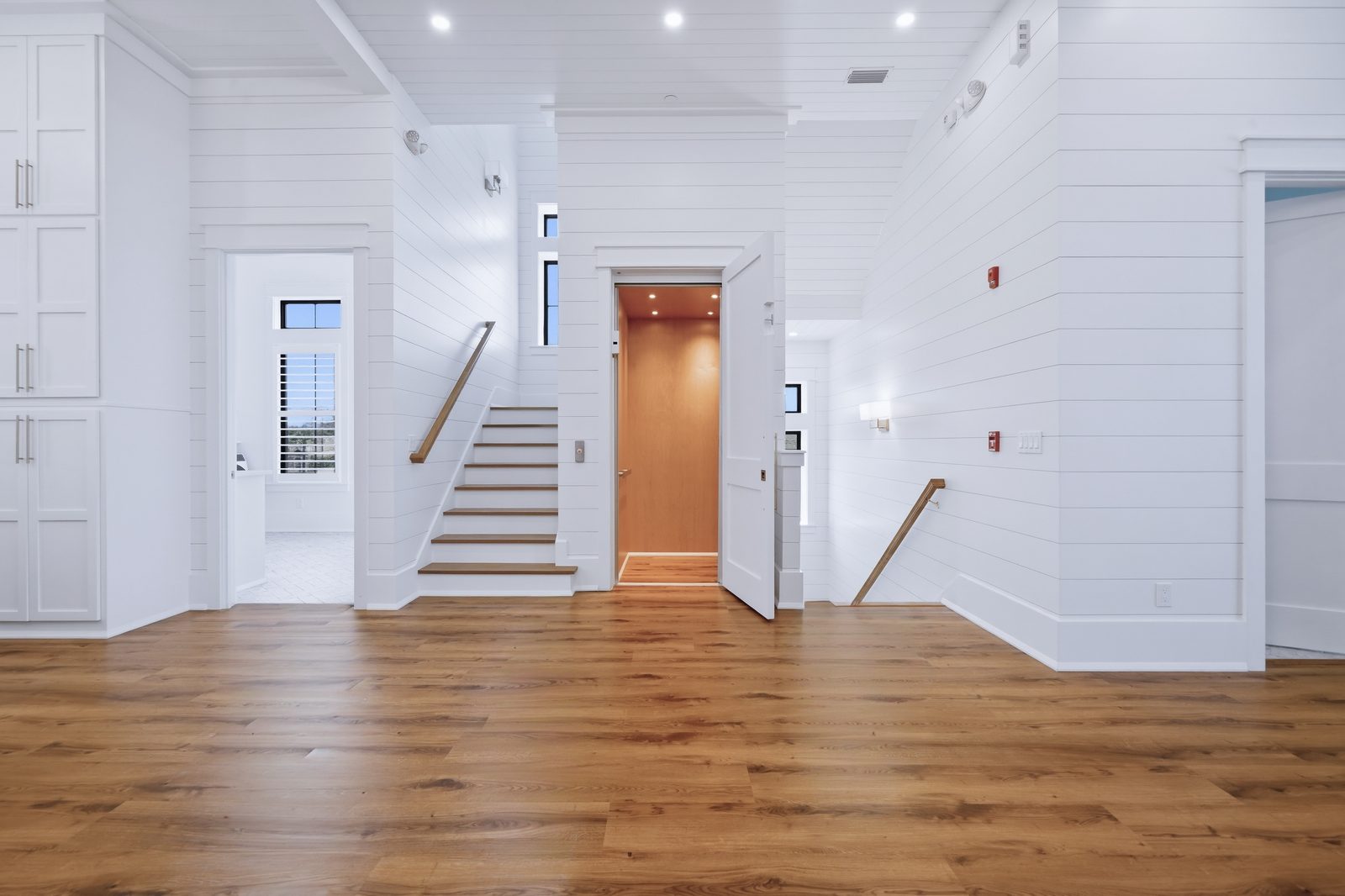 Entry hall with staircase and elevator