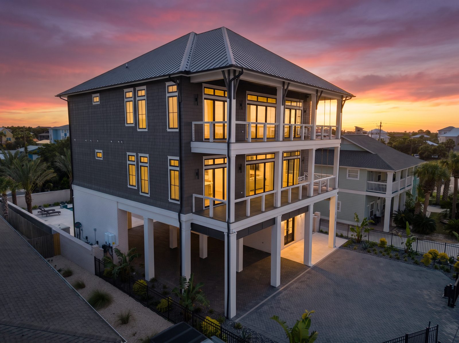 Aerial twilight view of a three story coastal home
